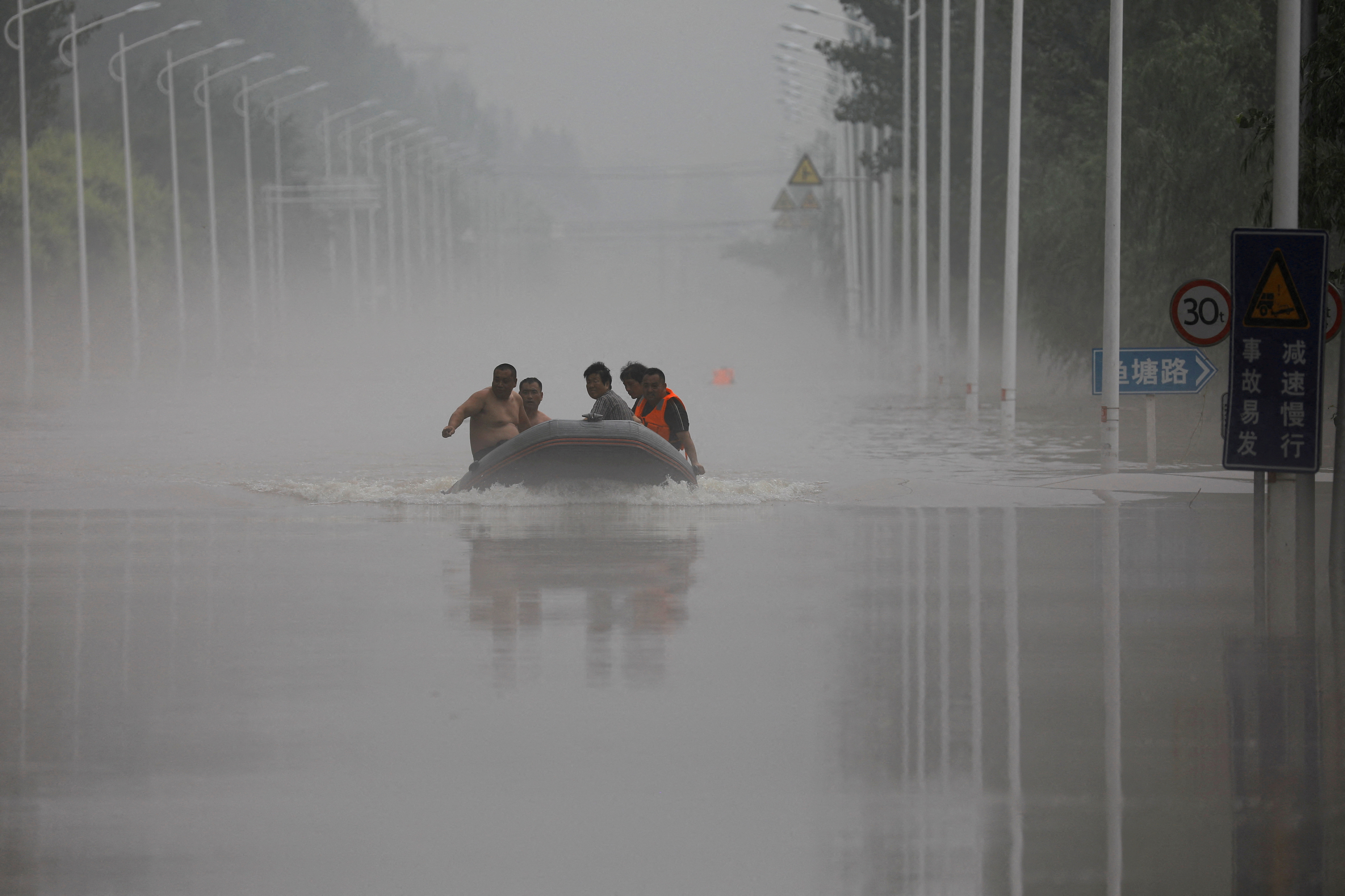 image China raises emergency response level for floods in northeast