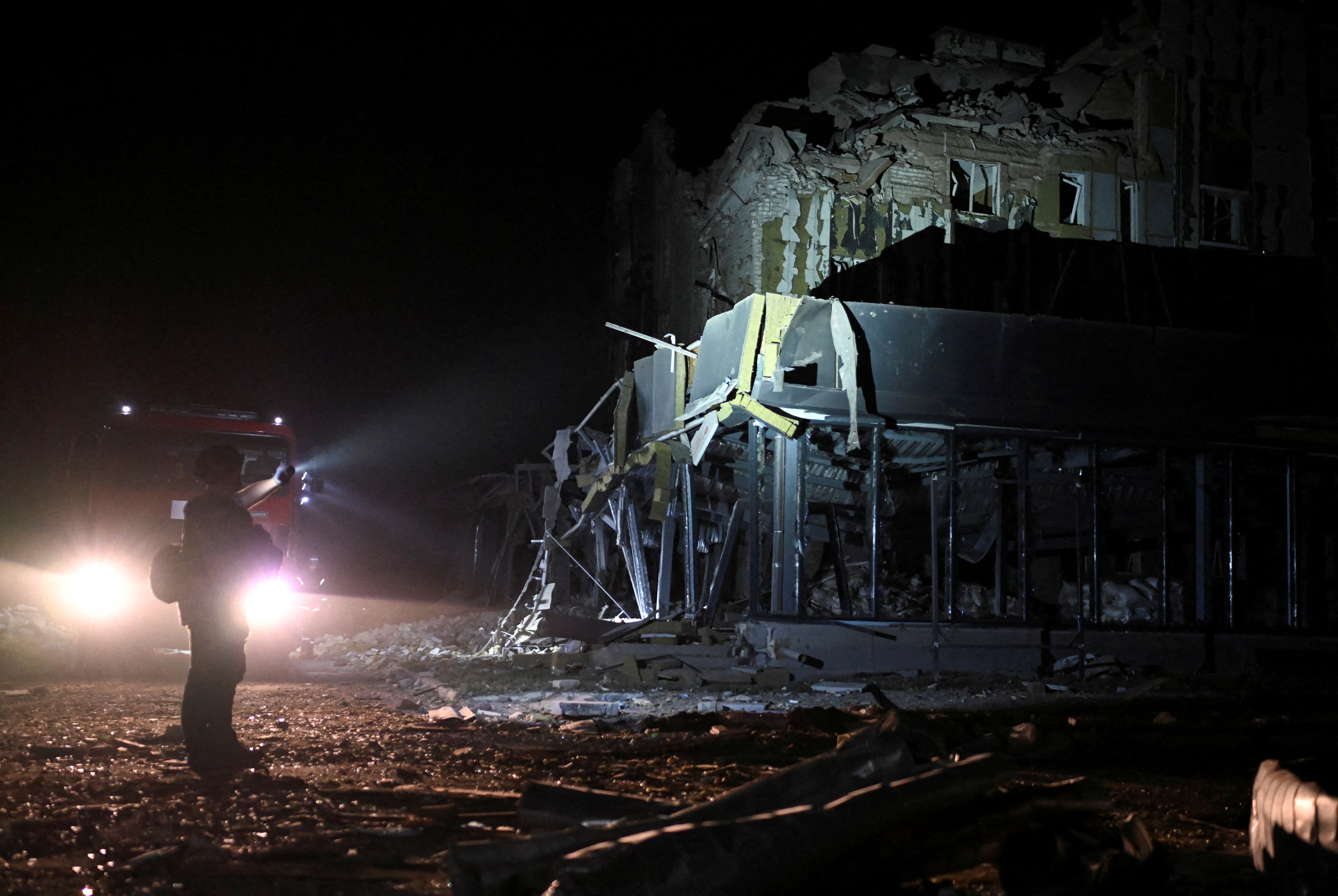 image Russian missiles hit apartment, kill eight, survivors describe fiery blasts