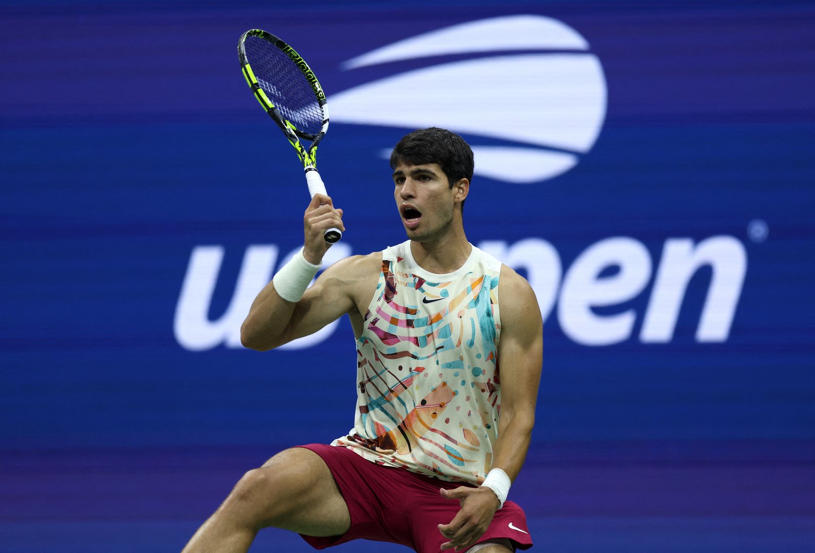 image Alcaraz and Medvedev move on at U.S. Open as Isner exits with a bang