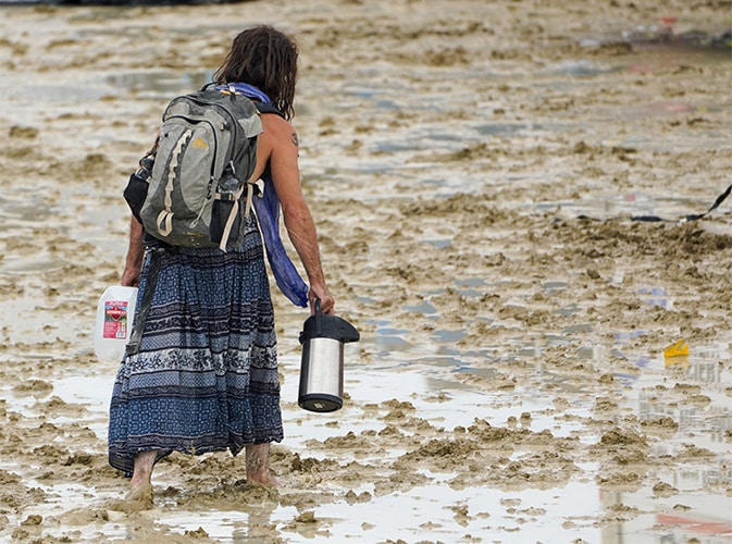 image Burning Man festival exodus set to start through drying mud