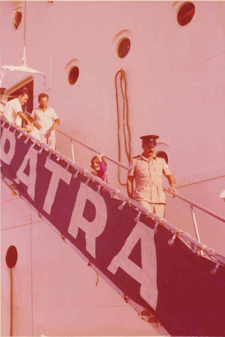 feature nik a girl boarding the ship patra that took the children to greece