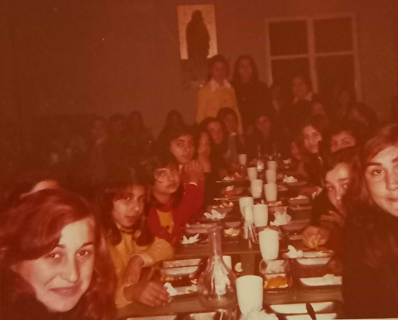 feature nik children eating in a mess hall of the church that offered them shelter