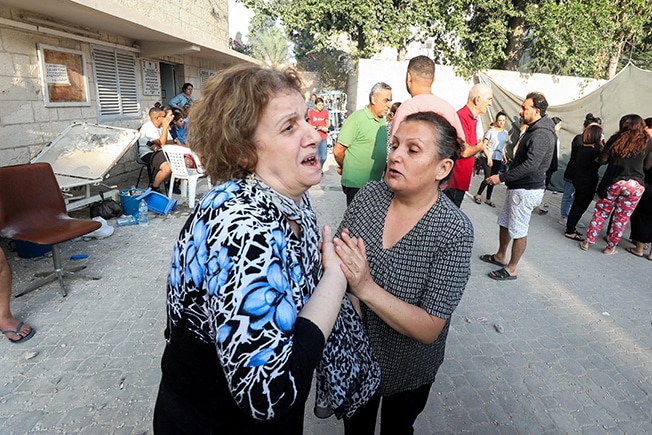 image Israel levels Gaza district, hits Orthodox church as invasion looms