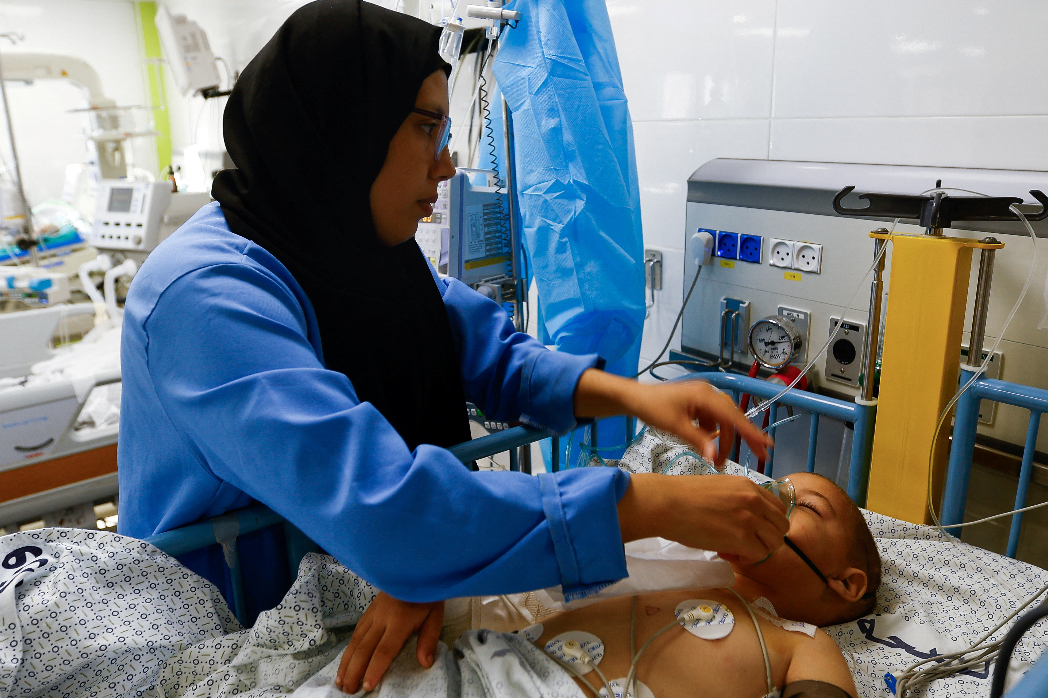 image Bombarded Gazans seek news of loved ones as blackout eases