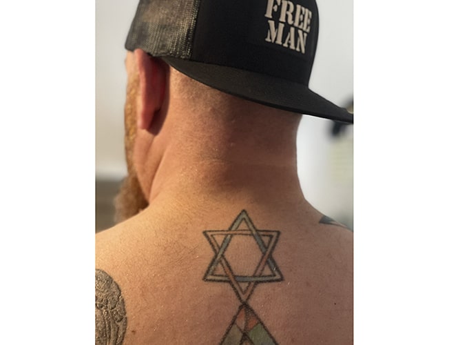 image Israelis ink the memory of deadly attacks onto their skin