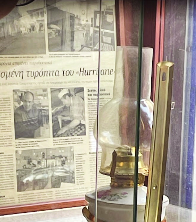 feature nick one of the newspaper reports on hurriance that line the cafe's walls