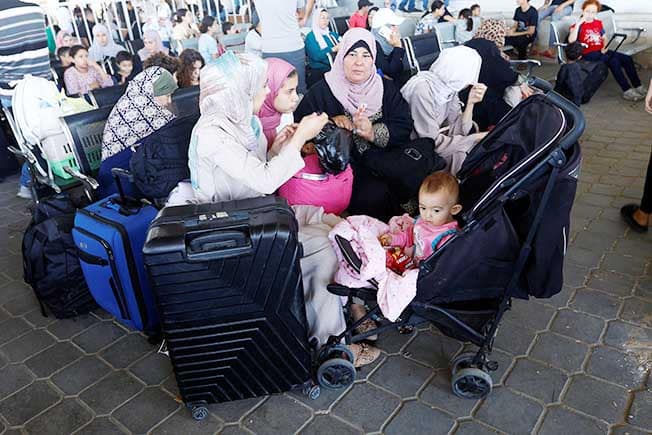 image Israel says it kills second Hamas commander in refugee camp, first evacuees leave Gaza