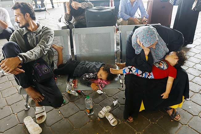 image Relief for Gaza evacuees, frustration for those blocked at Rafah crossing