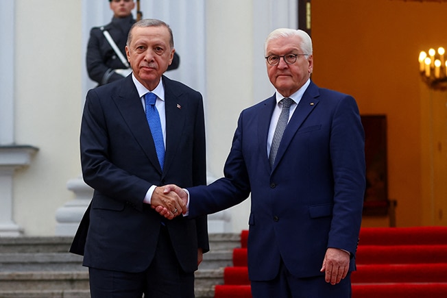 image Seeking jets and trade deals, Turkey&#8217;s Erdogan visits awkward ally Germany
