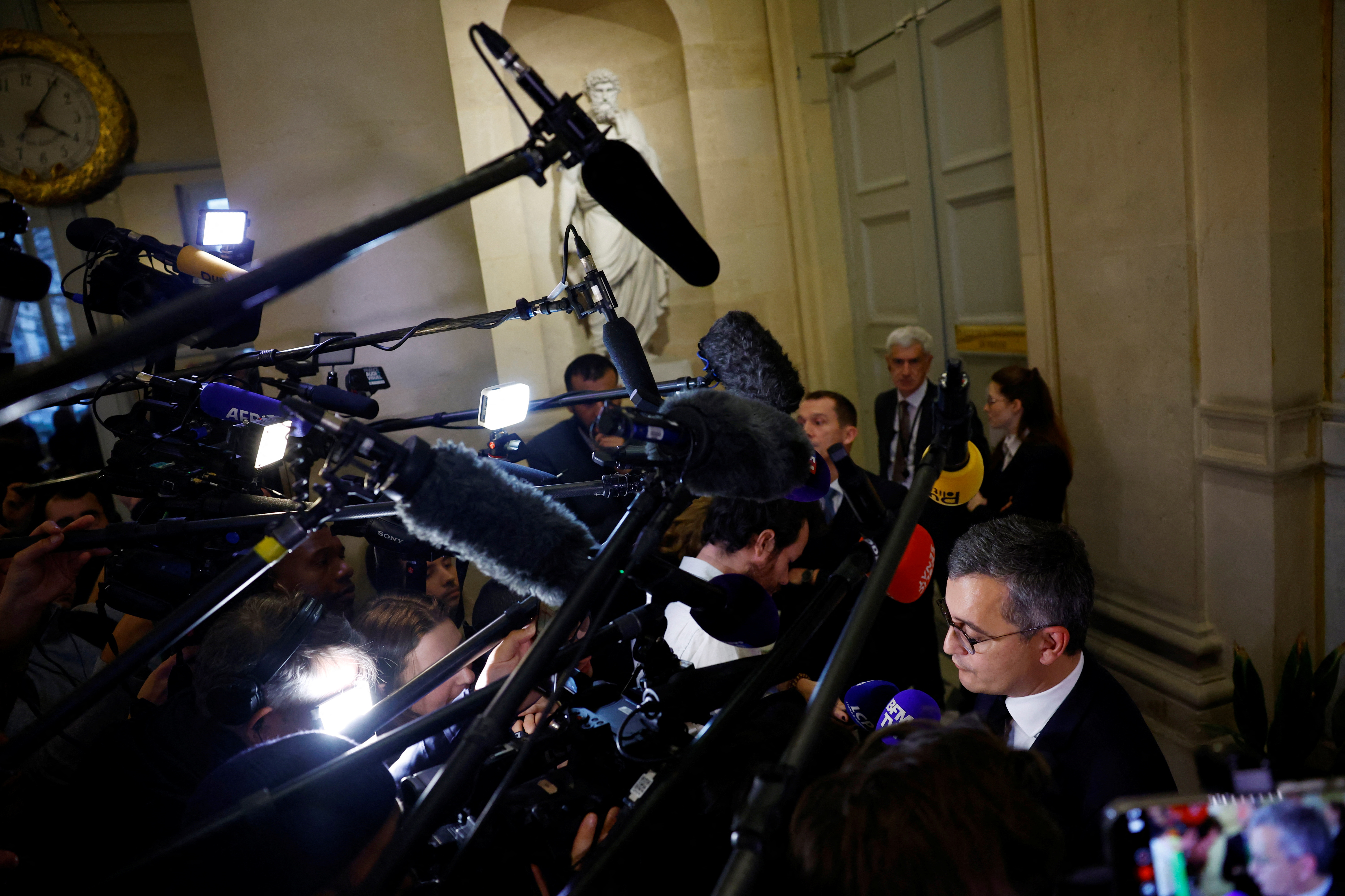 image French lawmakers strike tentative deal on tougher immigration bill