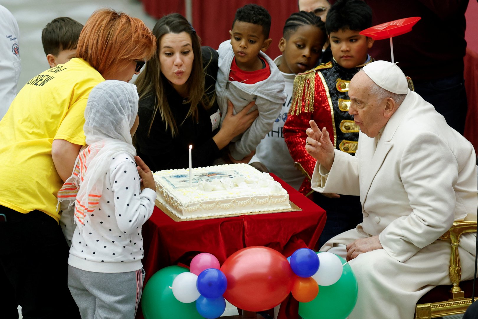 image Children help Pope Francis mark 87th birthday