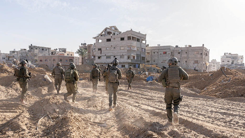 image Fighting across Gaza as Israel drops leaflets seeking its hostages
