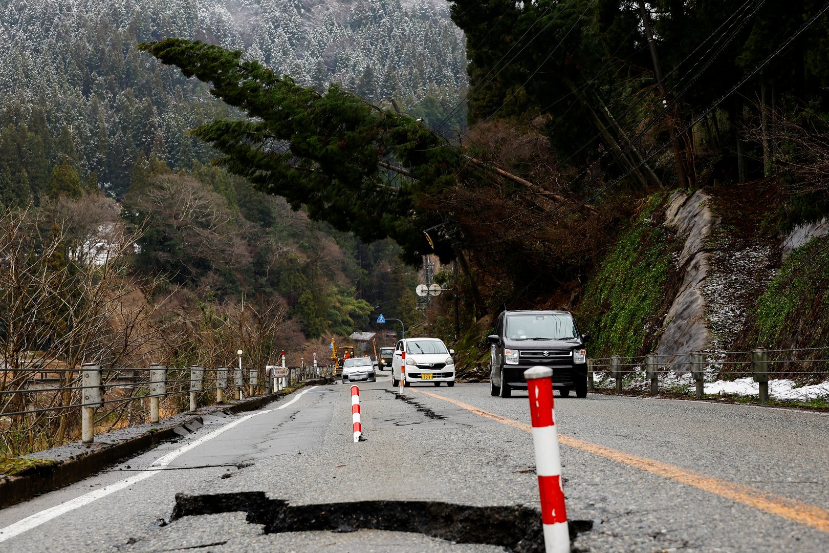 image Japan premier vows “ceaseless” aid as snow hampers quake relief