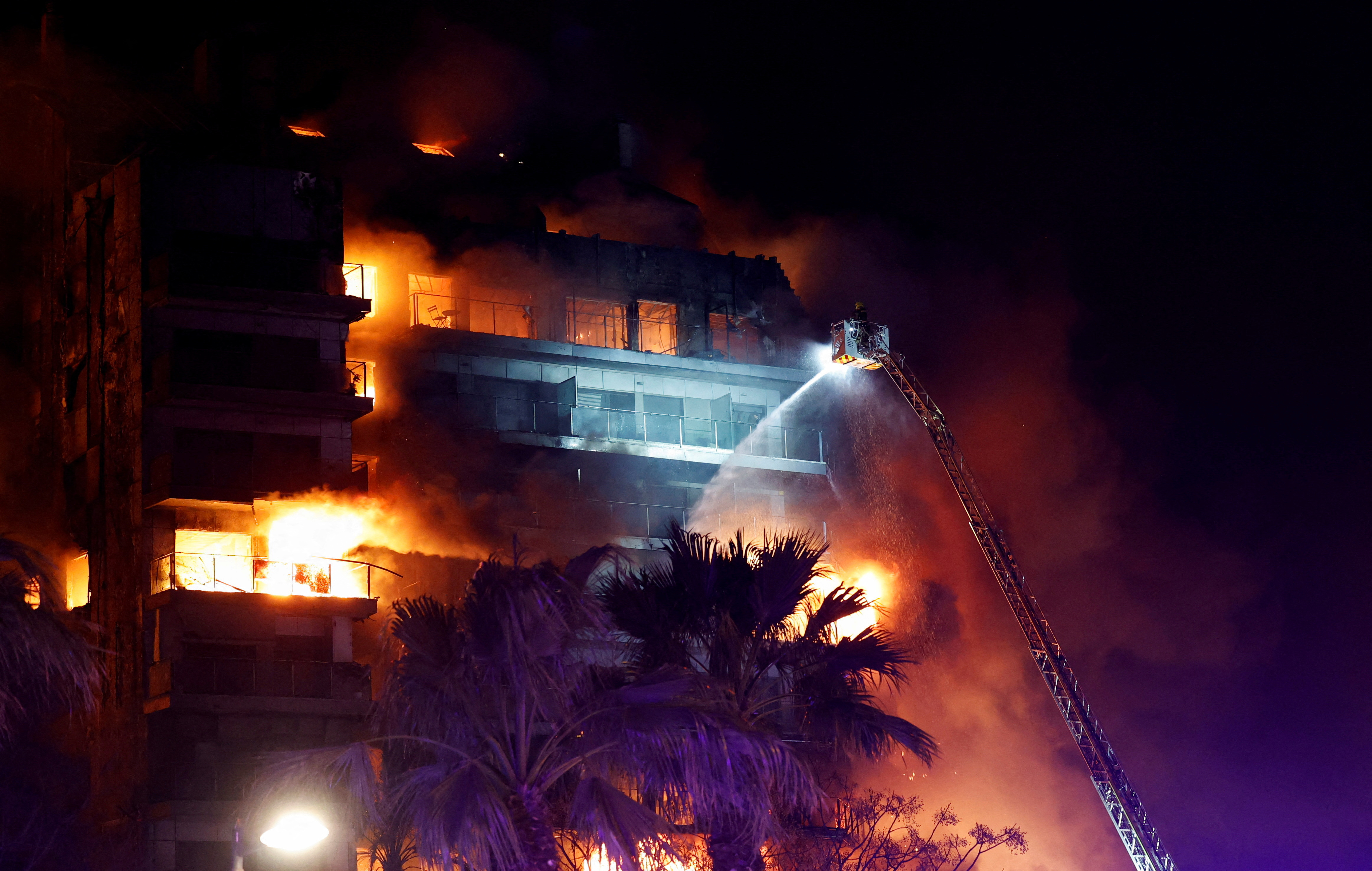 image Spain apartment building engulfed in flames, at least four dead