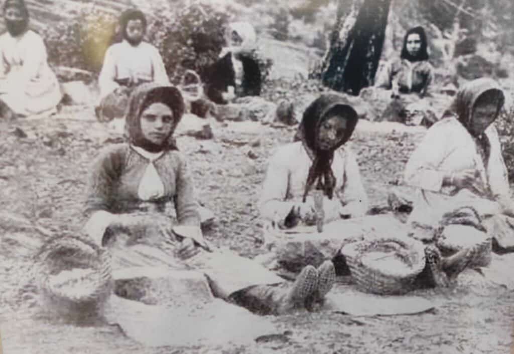 feature iole women cracking rocks