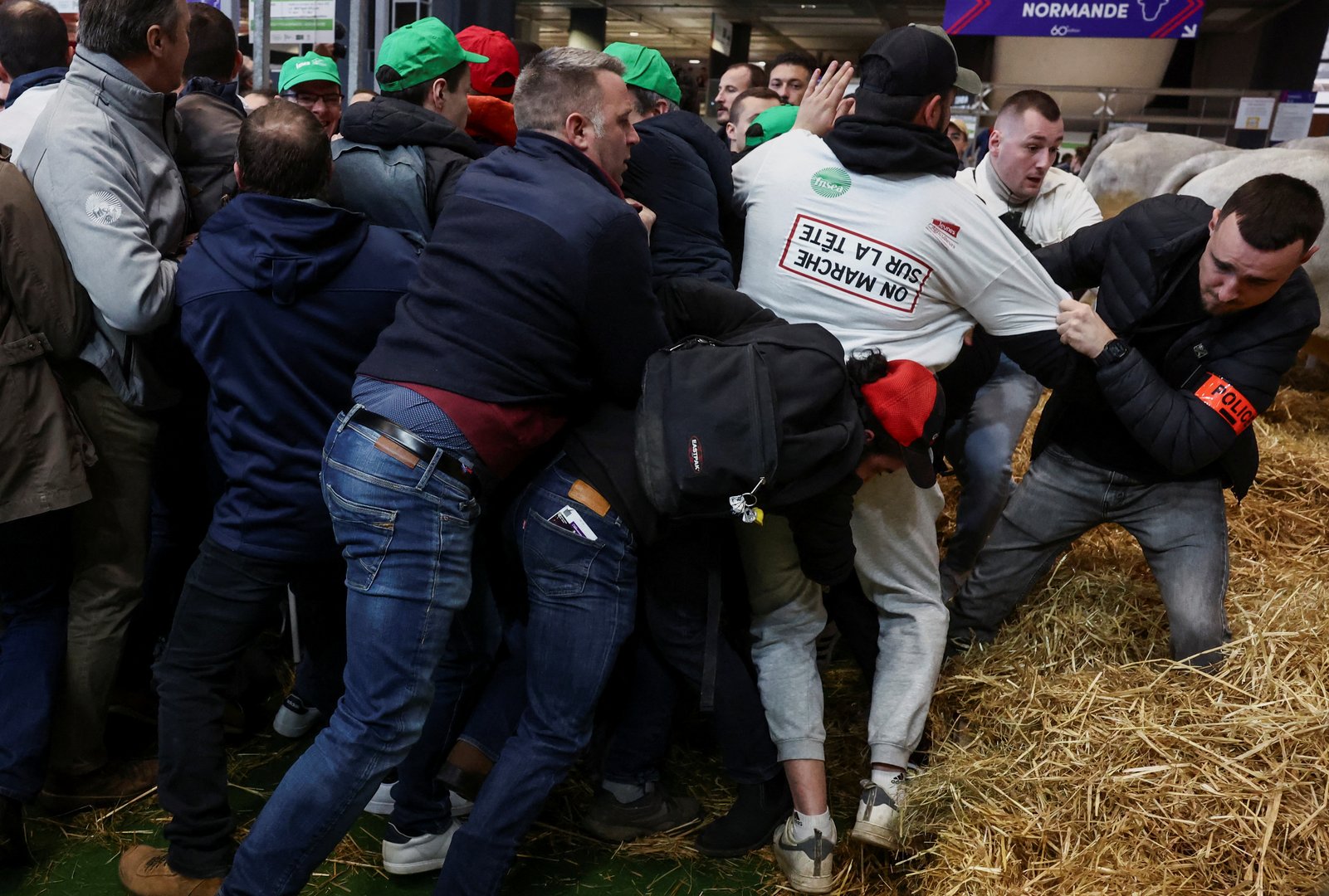 image Angry French farmers storm into agriculture fair in Paris