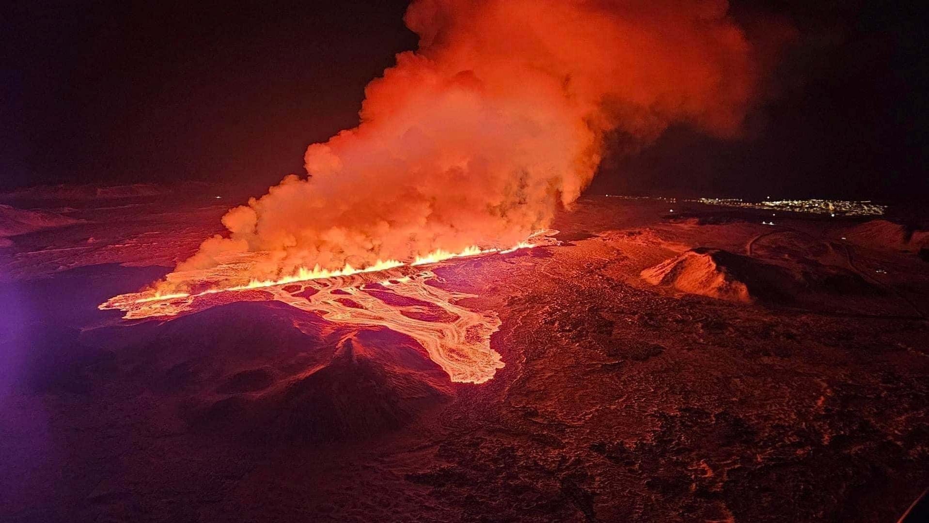 image Iceland volcano erupts with lava fountains, disrupts heating and roads