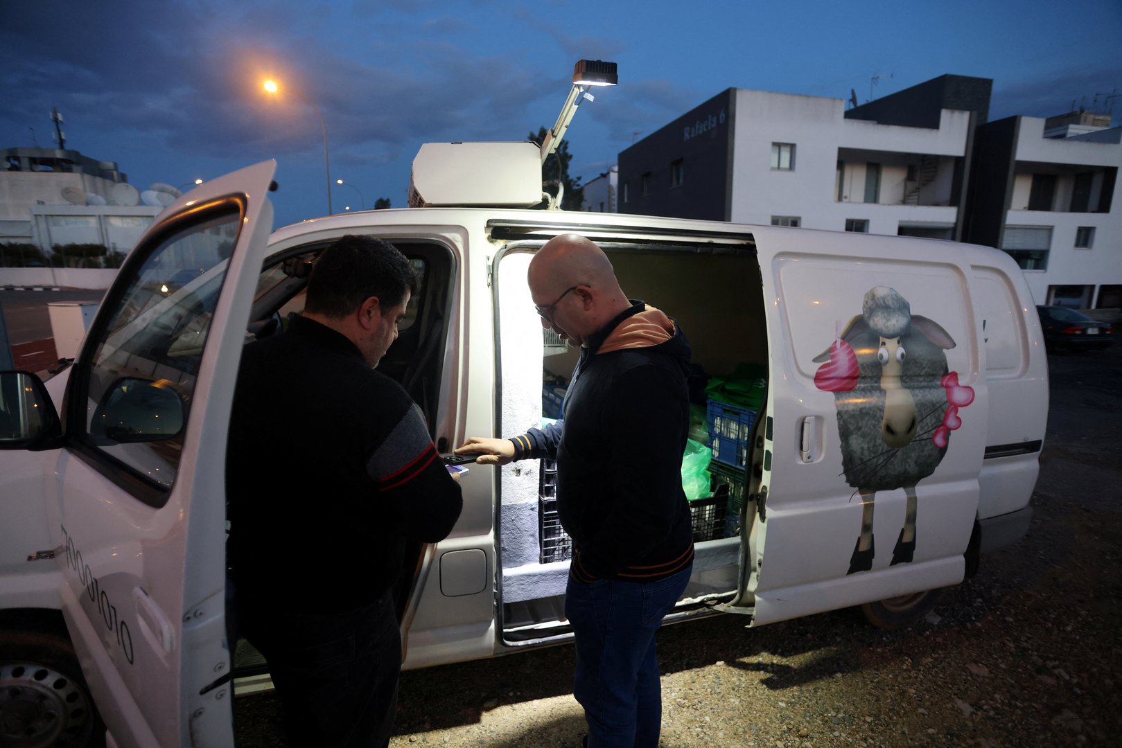 a man buys products outside pantelis panteli's van in nicosia