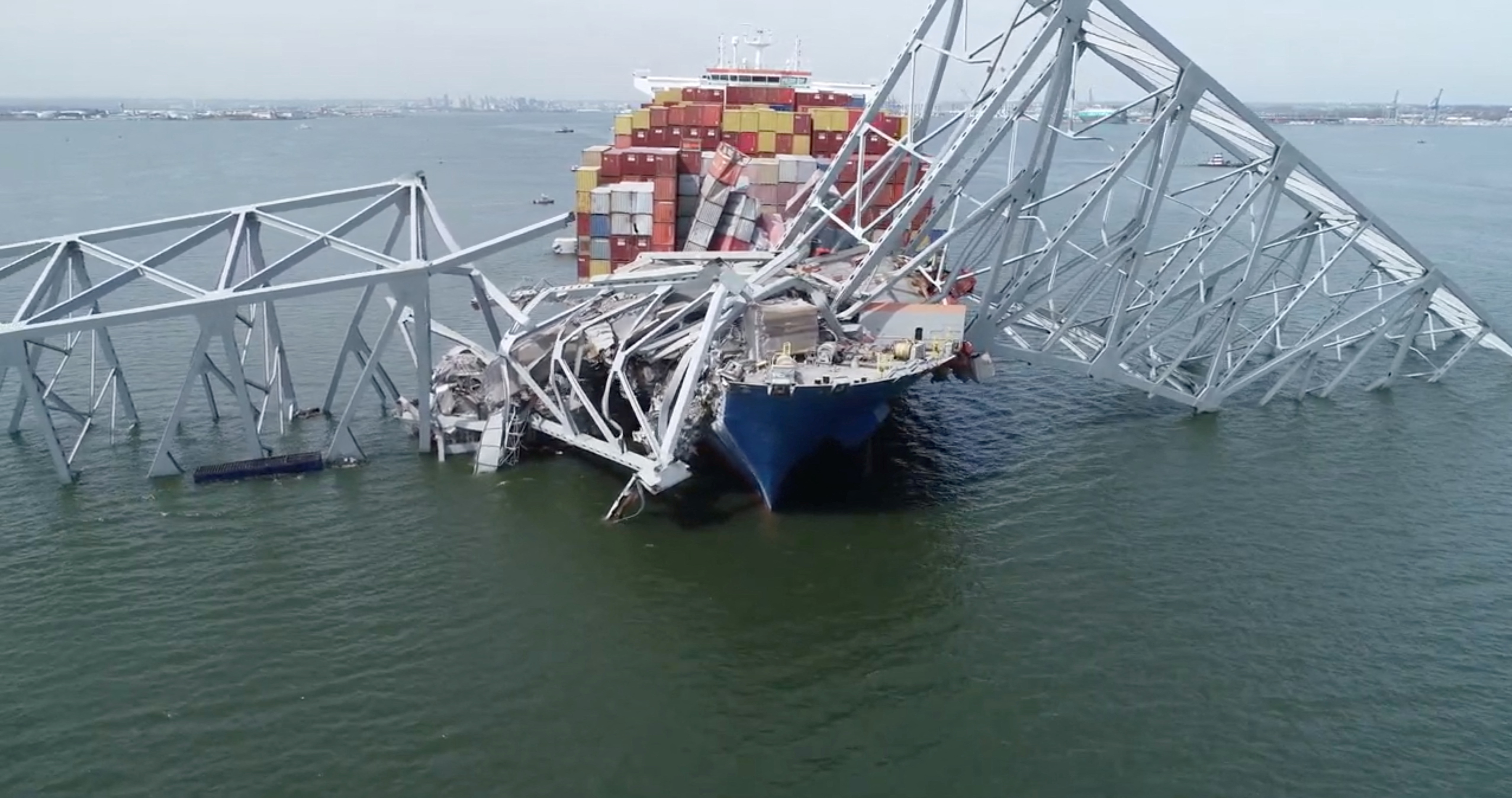 image Officials board ship that hit Baltimore bridge, divers search for bodies