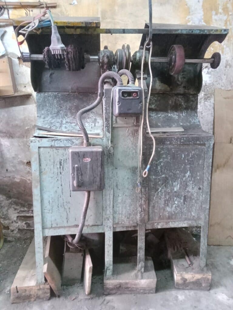 feature grace an outsole stitching and band scouring machine (right). band scouring is where they grind the heel of the shoe to smooth it out
