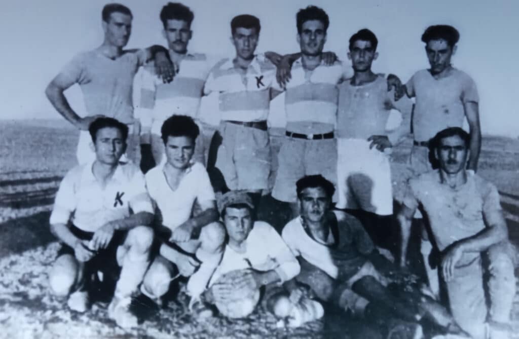 feature grace photo of andreas and his football team (bottom row second from left)