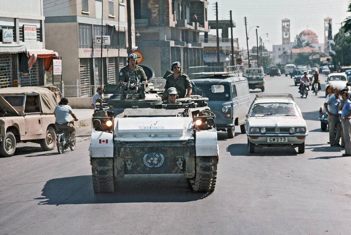 feature tom members of the canadian contingent in a lynx  armoured vehicle patrolling the green line in nicosia in 1974