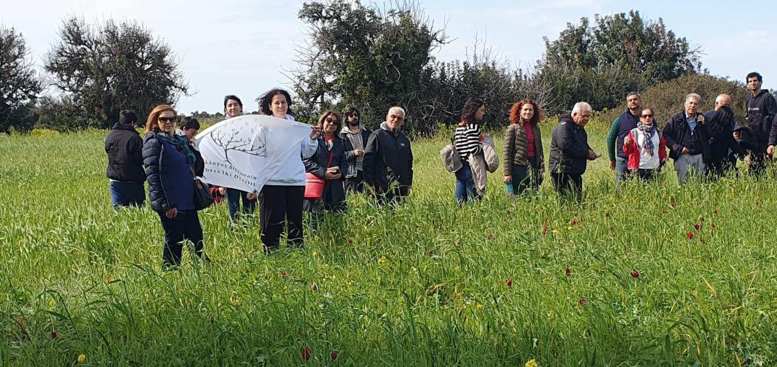 feature tom the group visiting the tulip fields outside the village