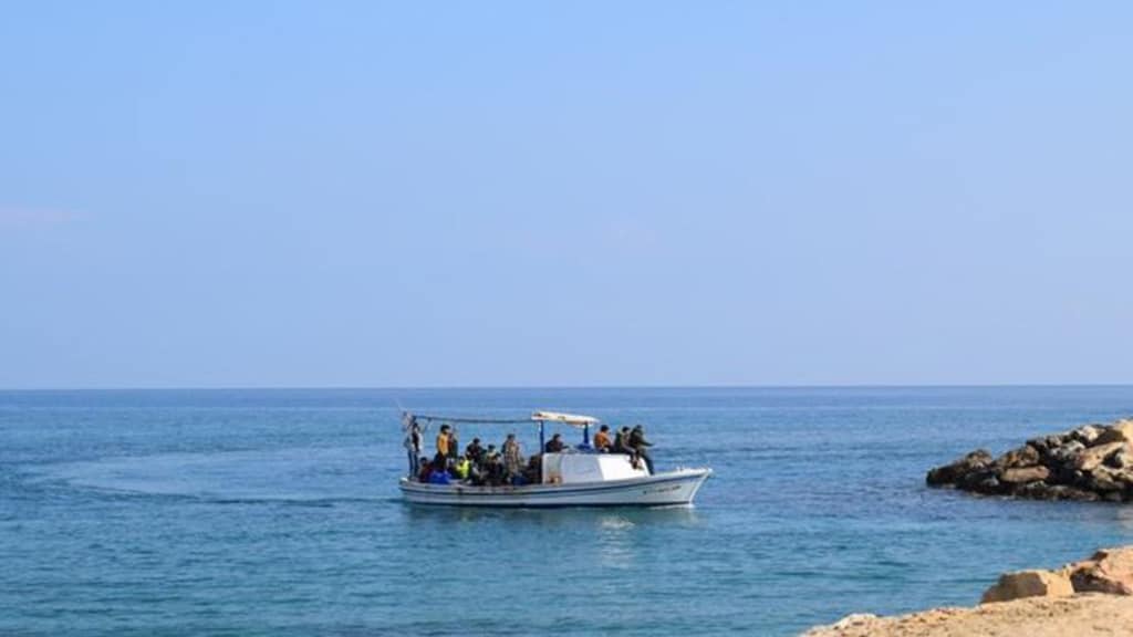 image Syrians in boat off Cape Greco taken to Pournara