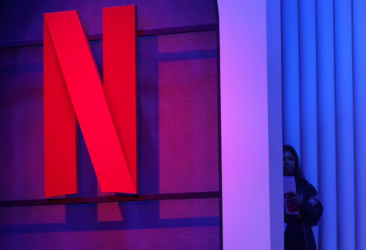 image Netflix slides as move to end sharing user count sparks growth worries