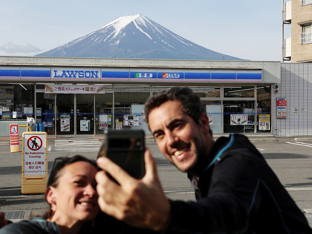 image Swarmed with tourists, Japan town blocks off viral view of Mt. Fuji