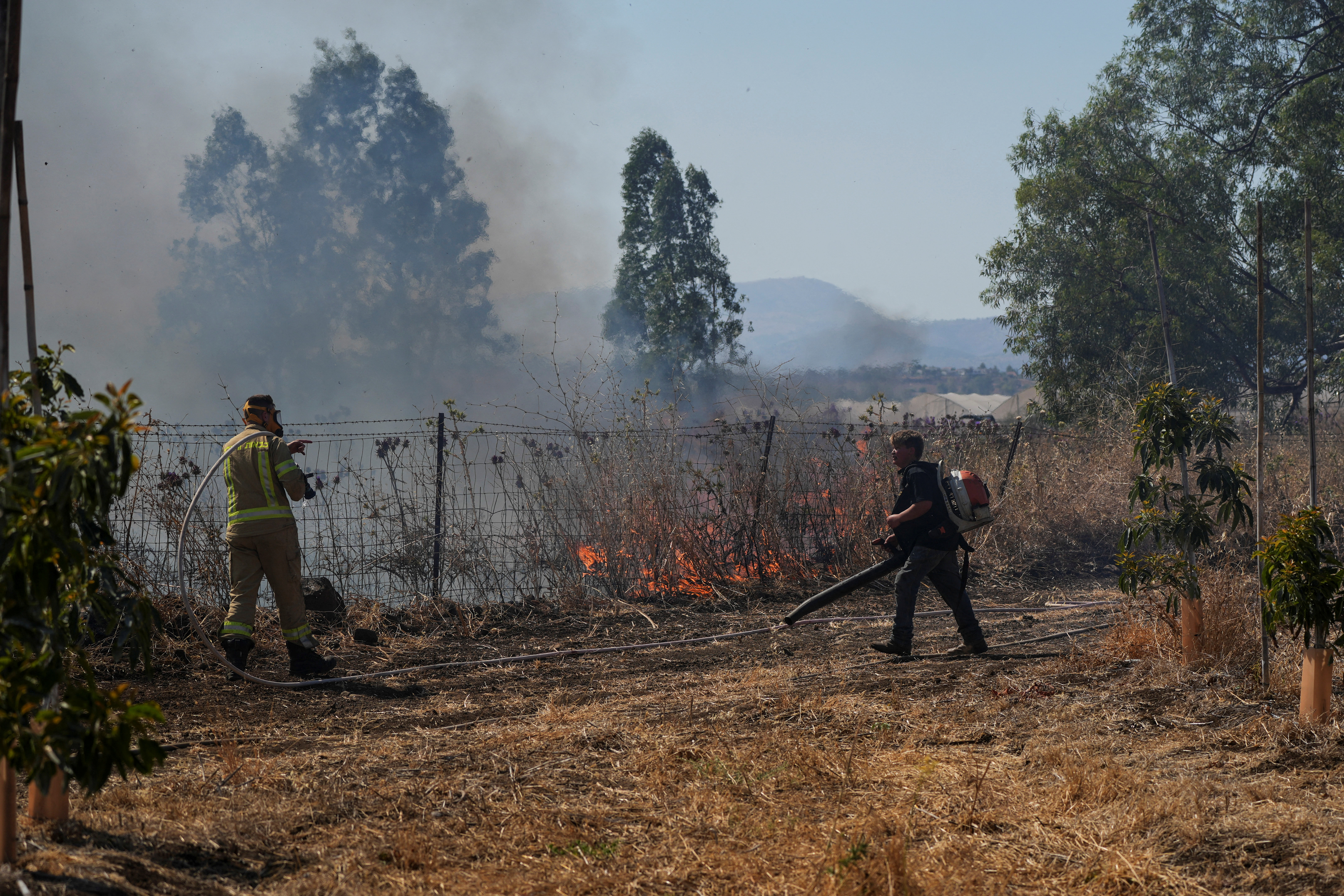 image Hezbollah fires big rocket salvo at Israel after senior commander killed