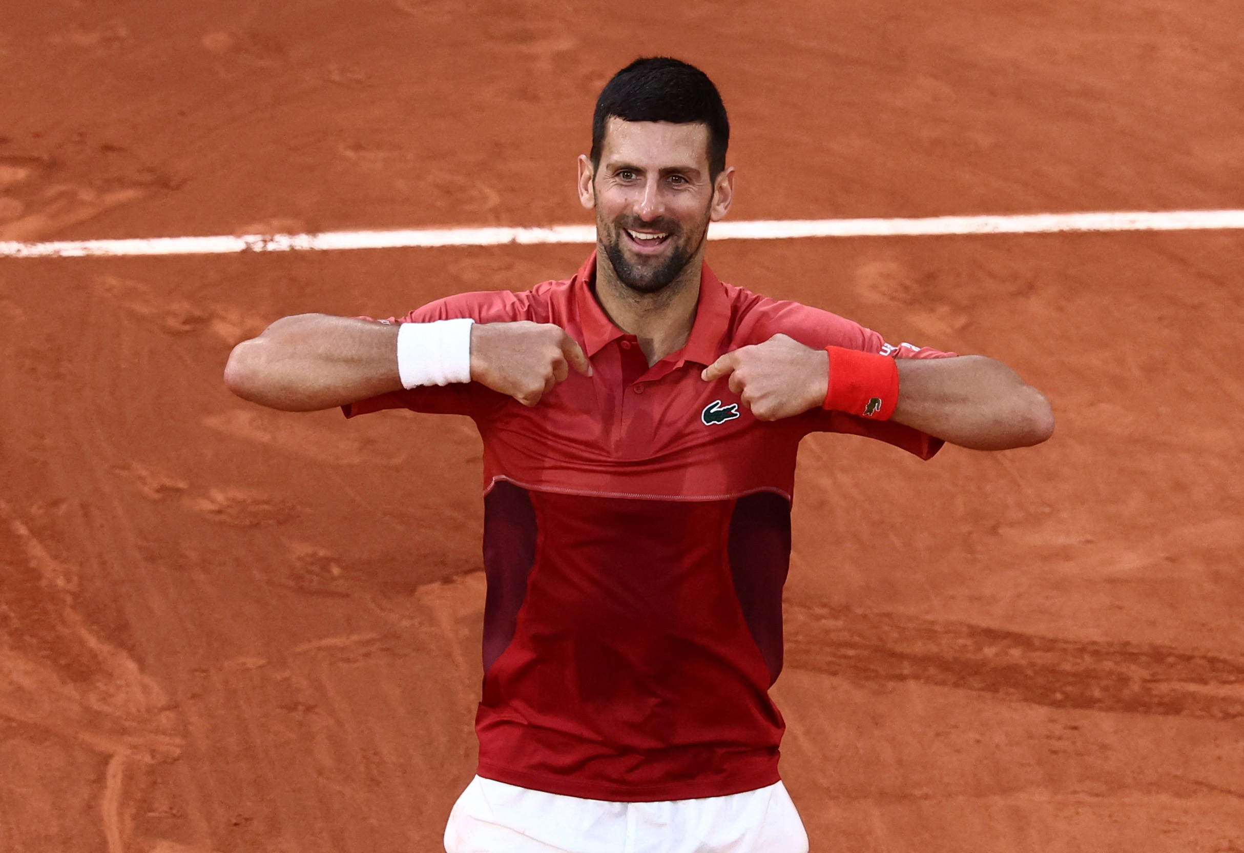 image Djokovic shrugs off injury to beat Cerundolo in another French Open epic