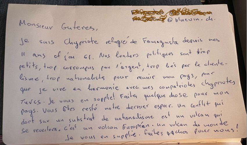 image Greek Cypriot refugee hands Guterres a pleading note on plane
