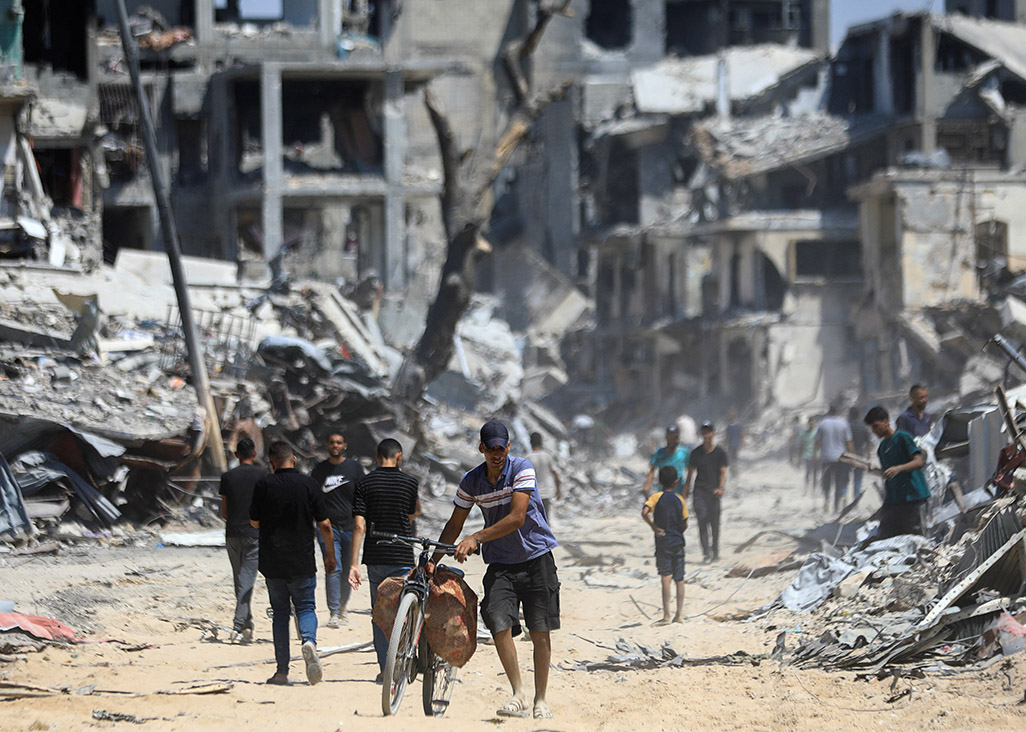 image Bodies trapped in Gaza City under Israeli assault as mediators push for truce