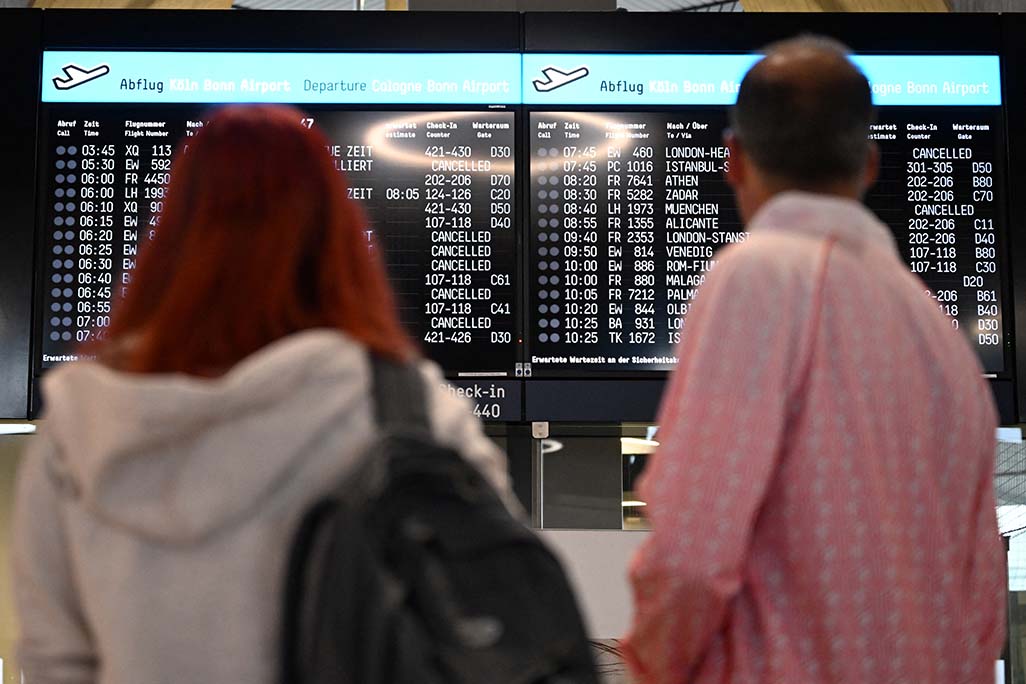 image Climate activists glued to runway halt flights at German airport