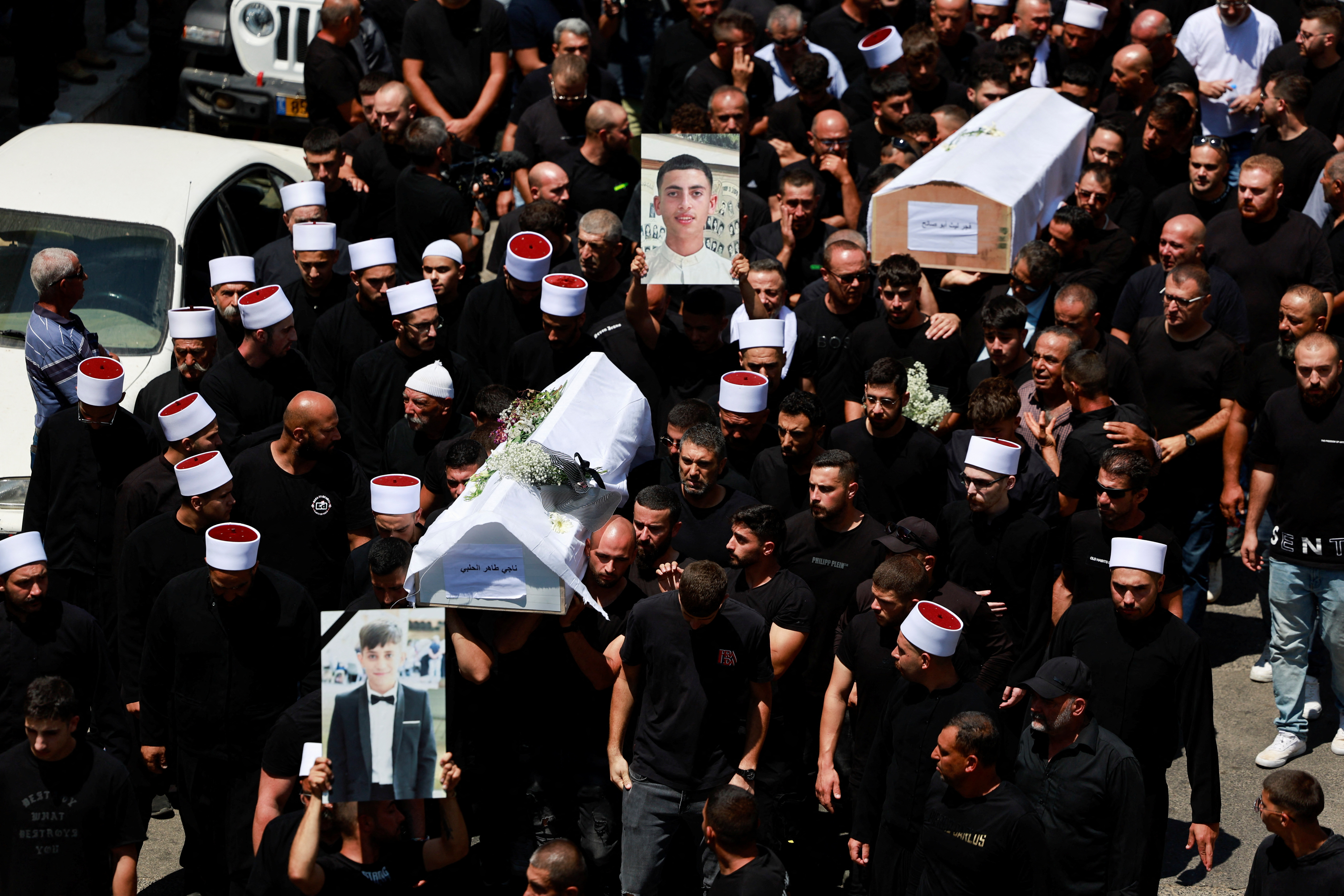 image Israel promises to hit Hezbollah hard after rocket kills 12 on football field