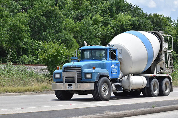 image Police cadet extinguishes roadside fire with help of cement mixer