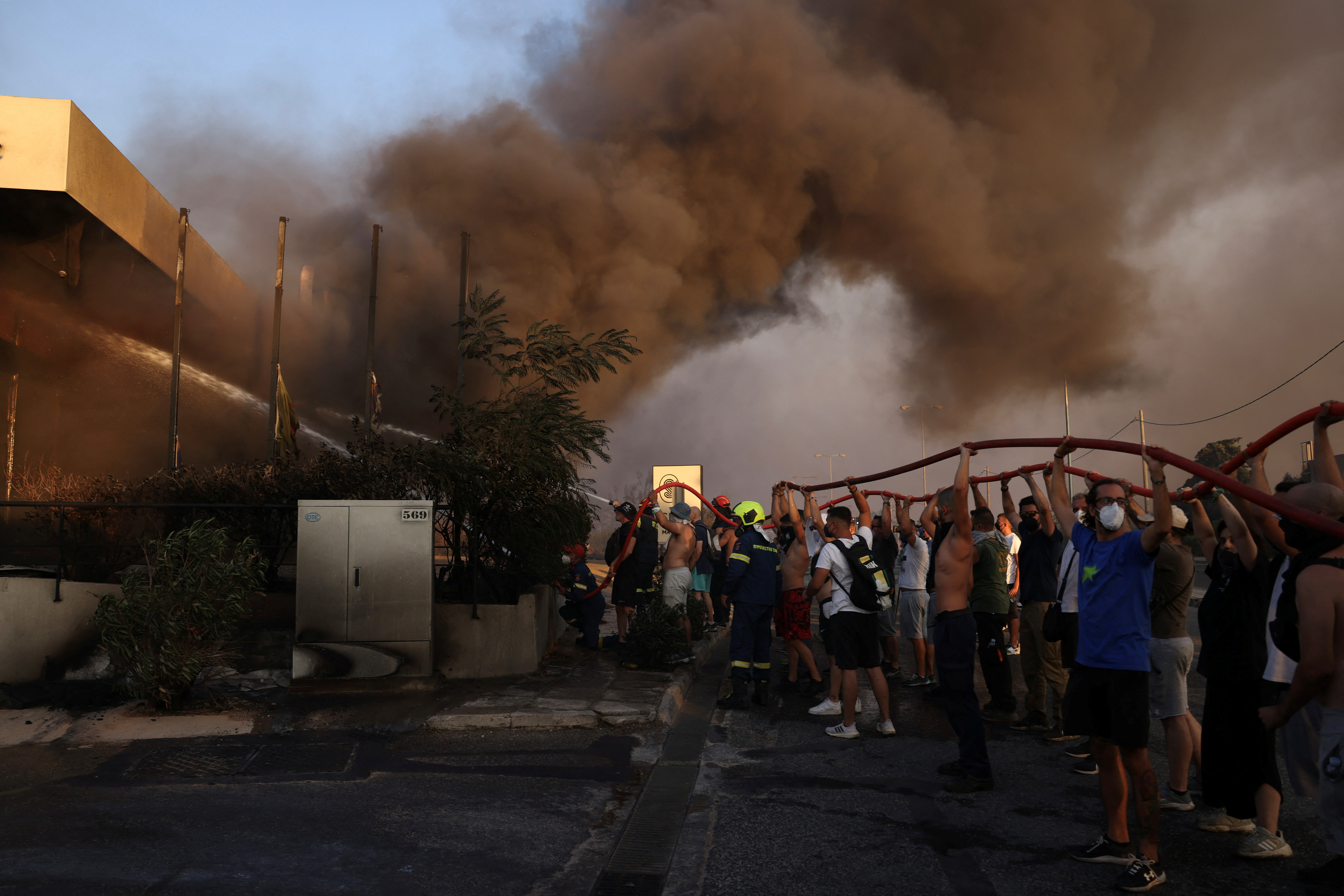 image One dead as Greek wildfire eases in Athens suburbs, but high winds expected