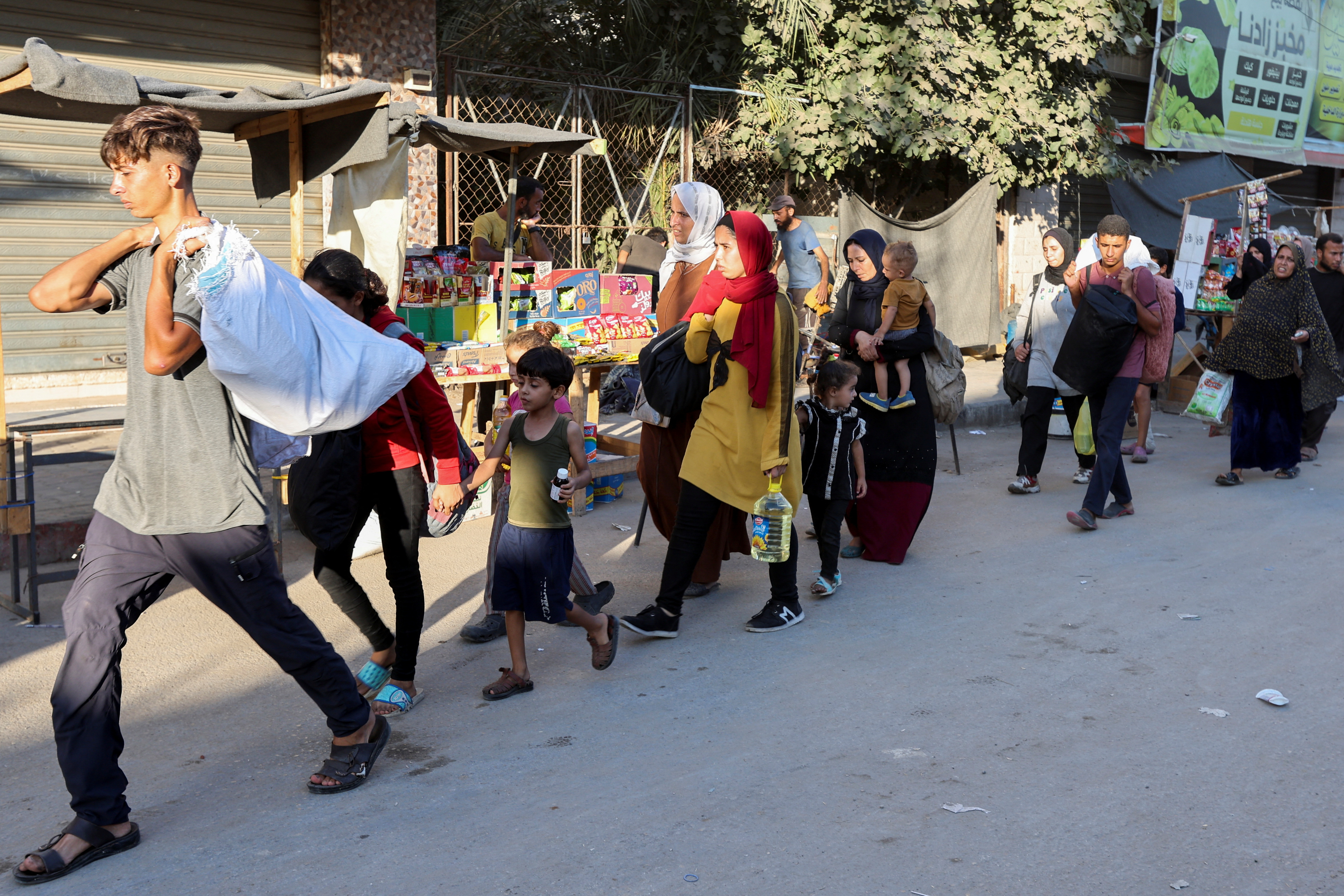 image Families flee after new Israeli evacuation orders in Gaza as ceasefire hopes dim