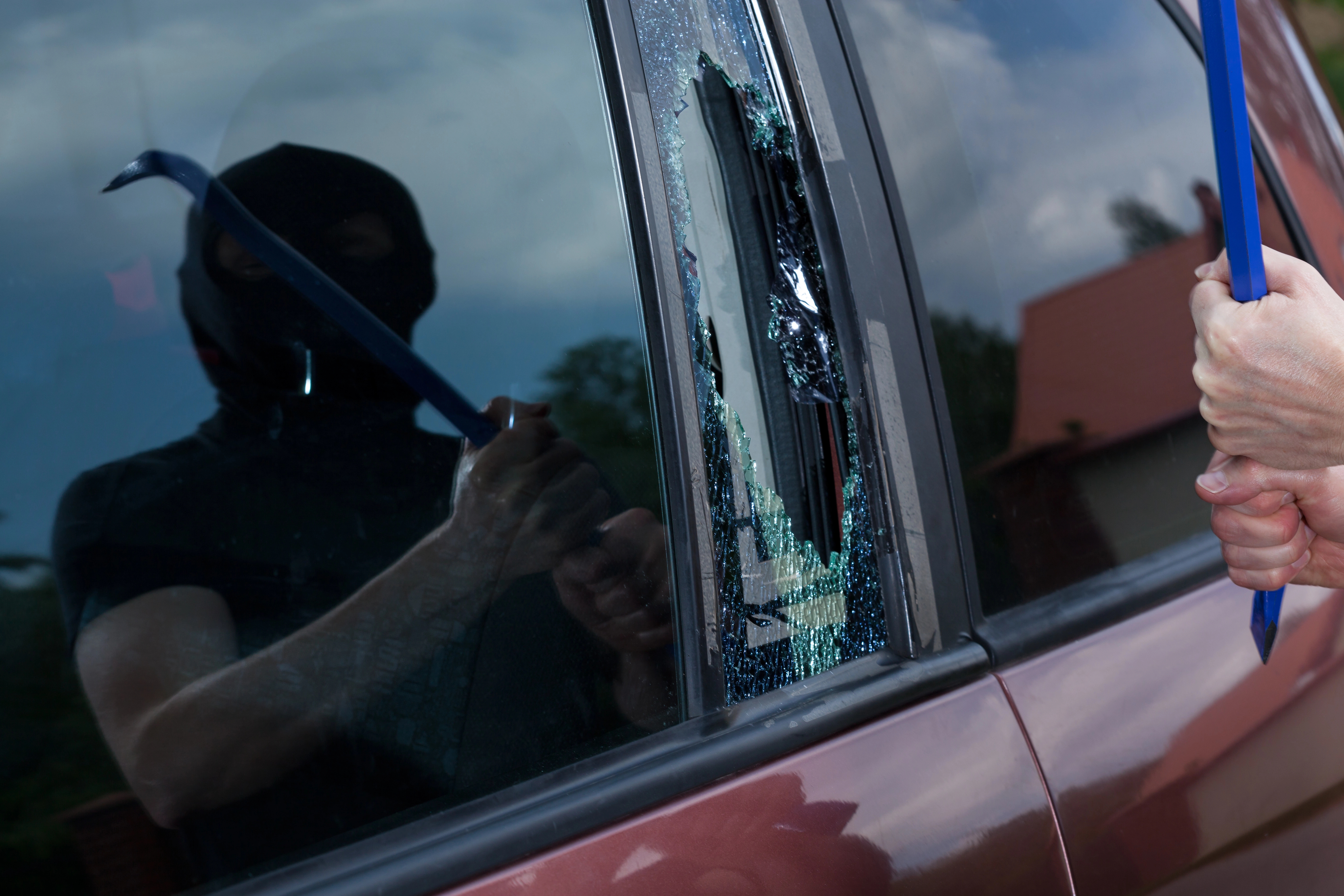 image 23-year-old caught red-handed breaking into parked cars