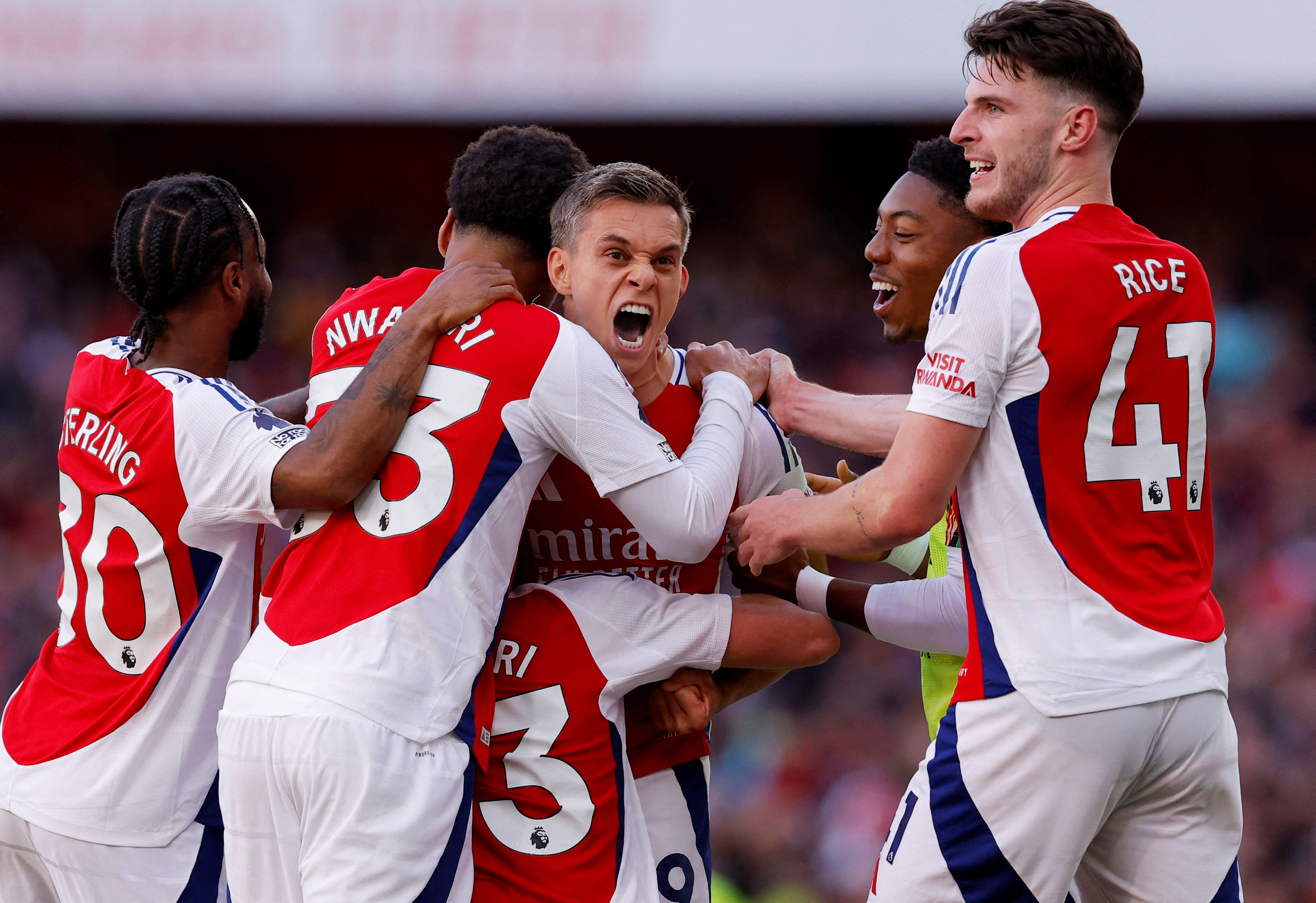 image Arsenal score two stoppage time goals to beat Leicester