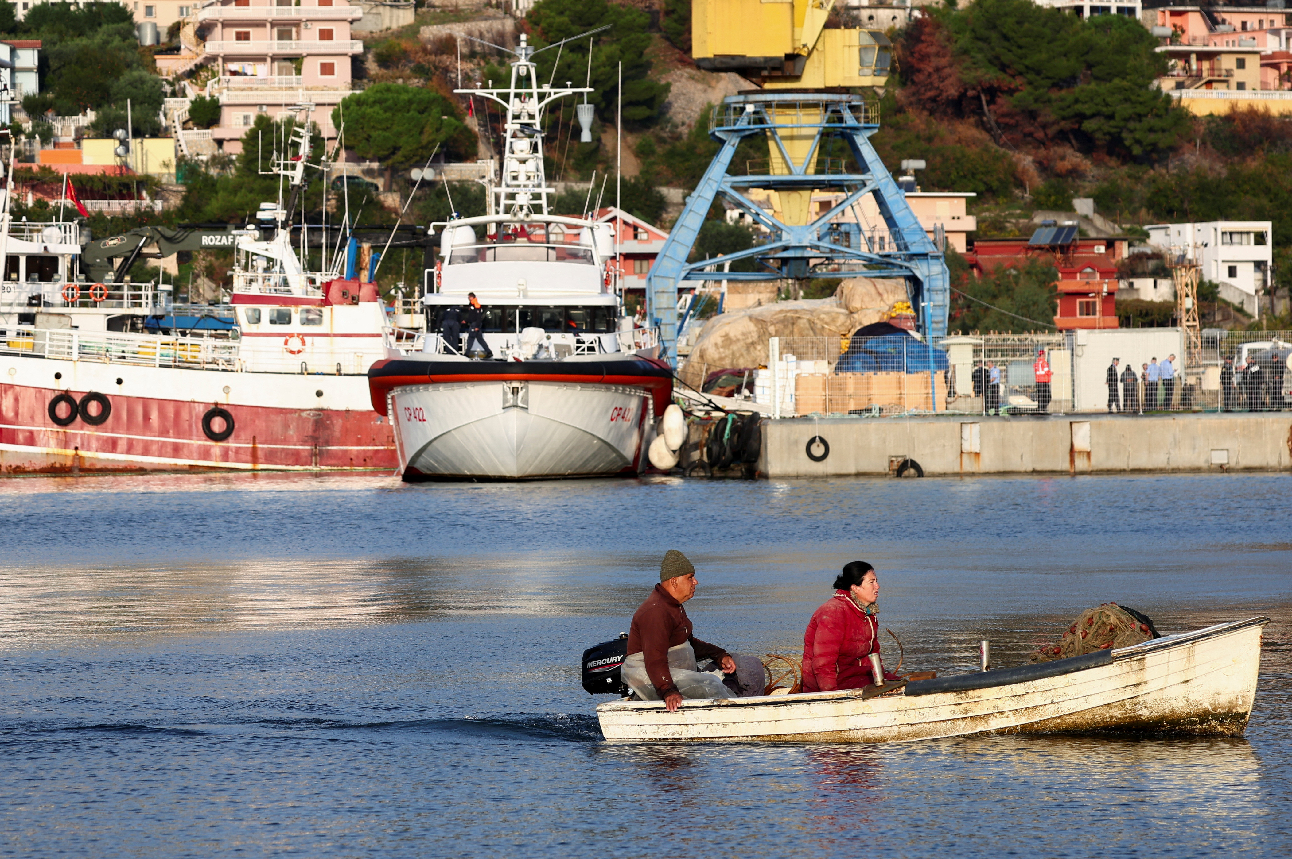 image Italian coastguard vessel picks up migrants from Albania to transfer them to Italy