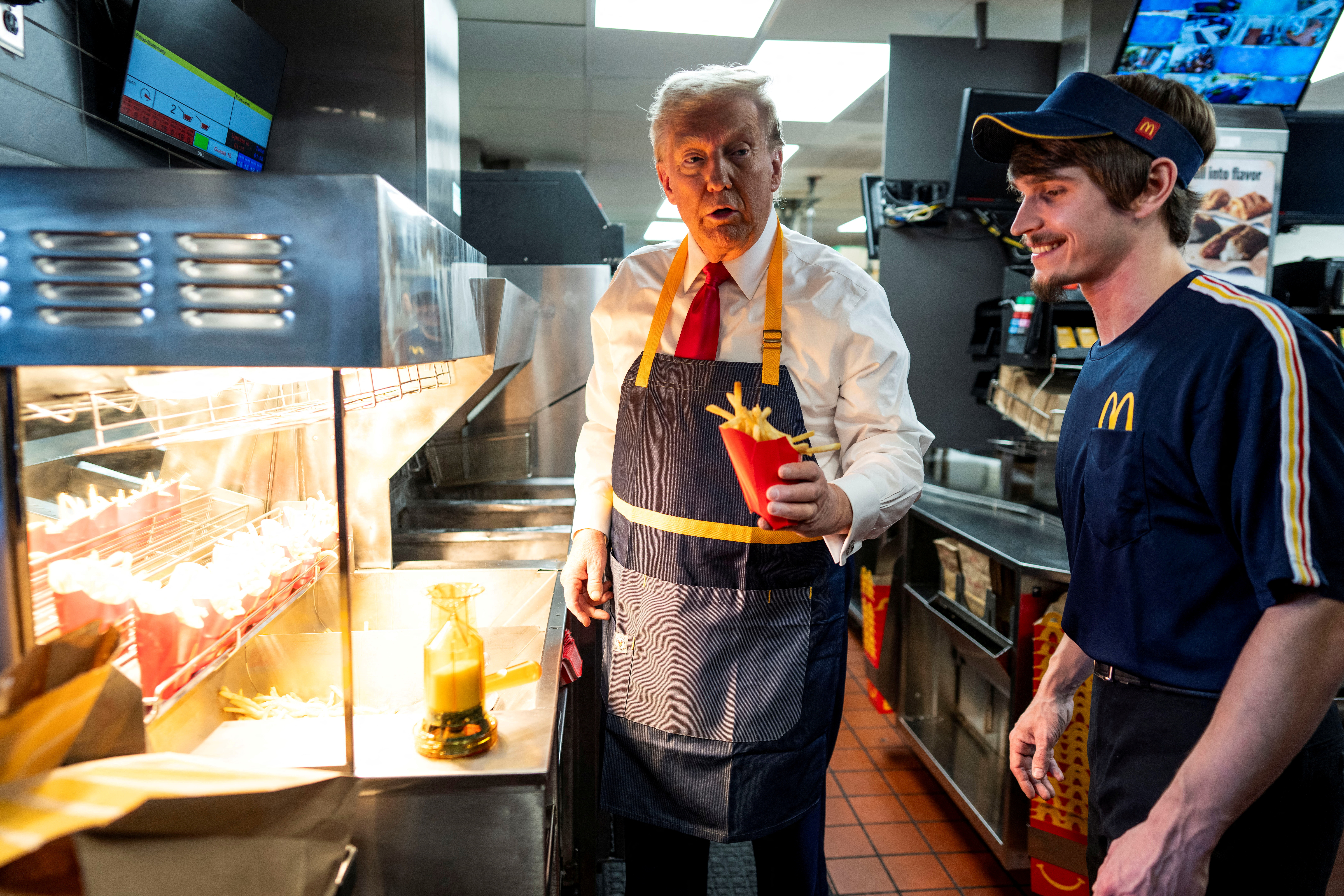 cover Trump hands out french fries in Pennsylvania, Harris visits Georgia churches in swing-state appeals