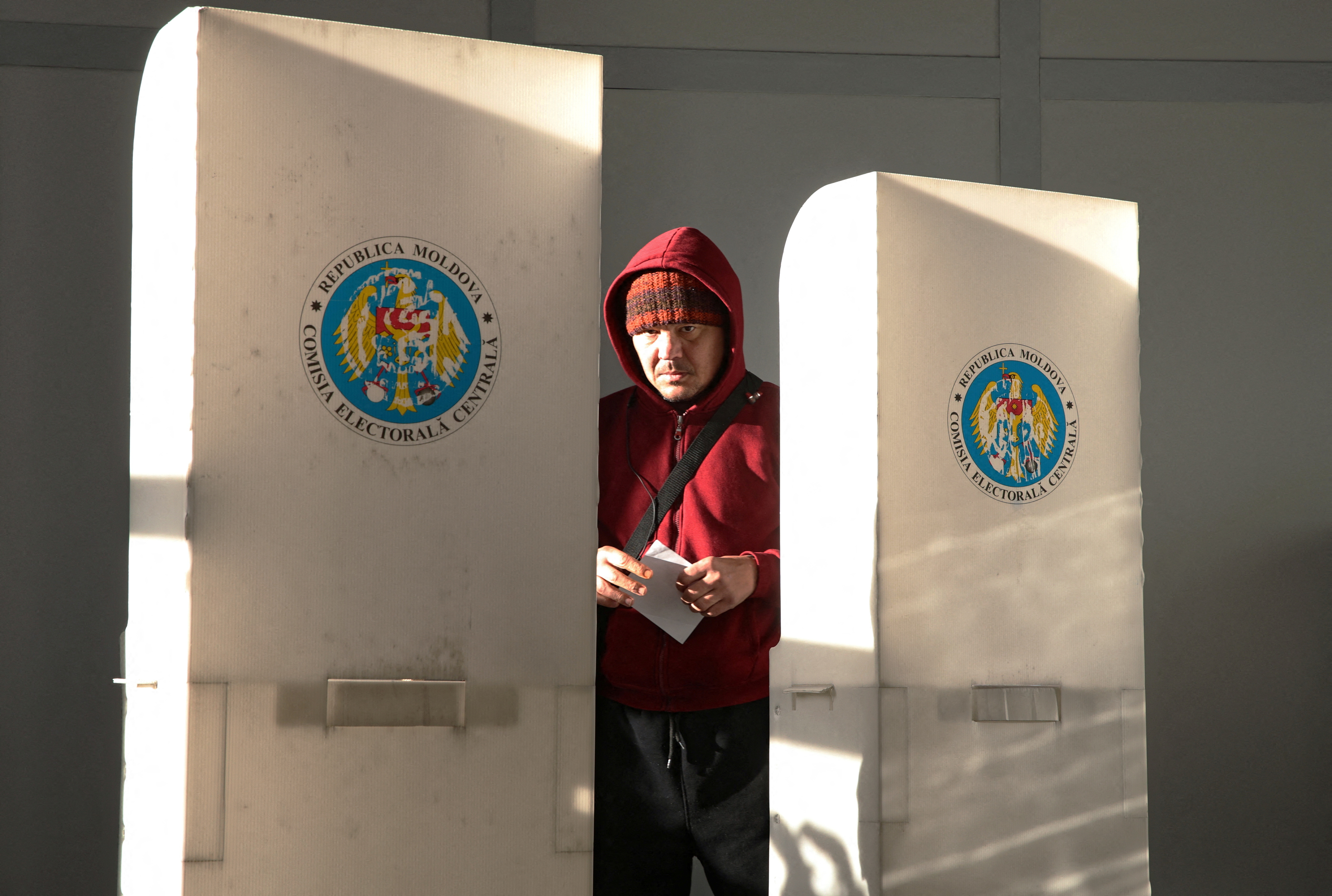 image Moldovans vote in presidential runoff amid fears of meddling