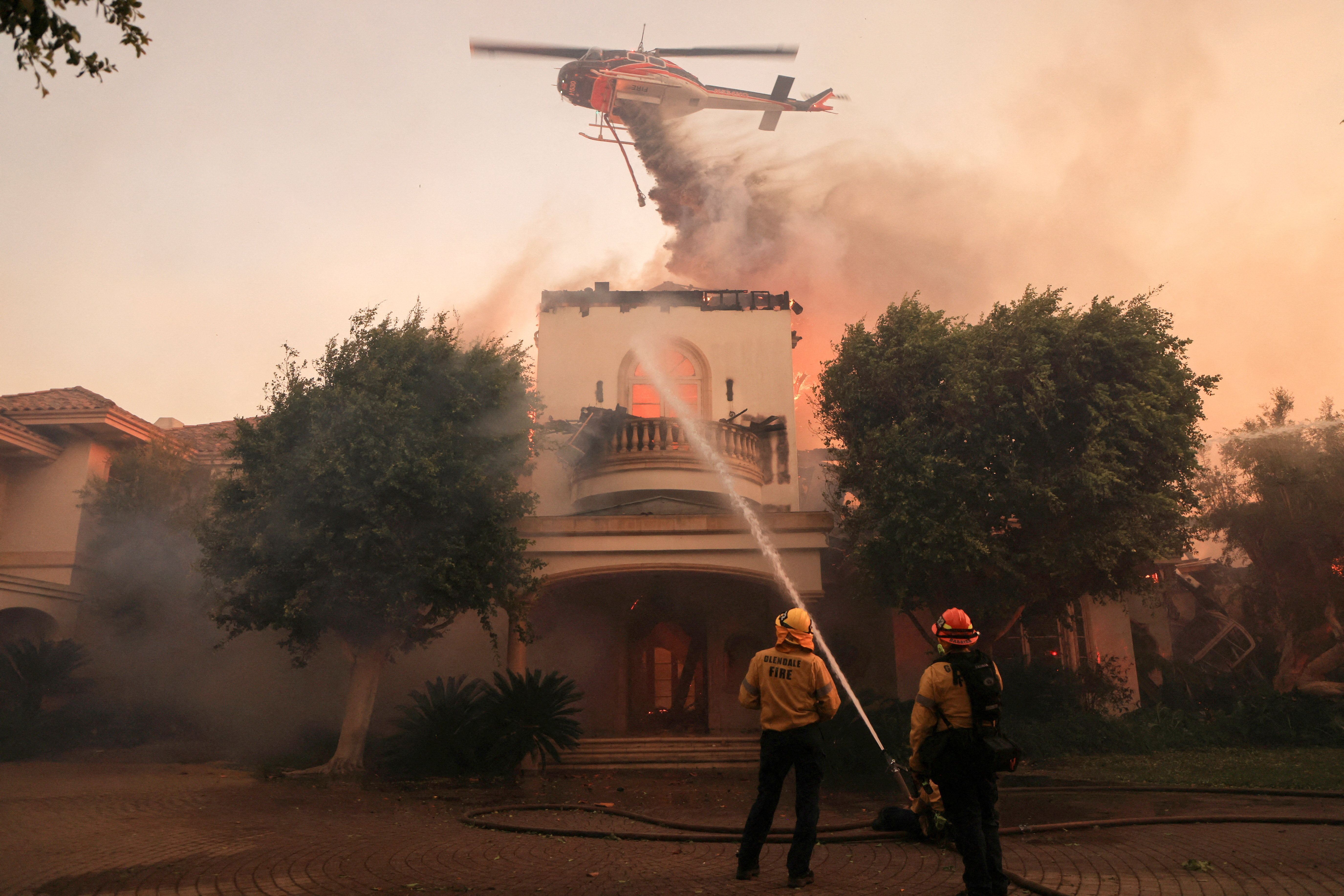 image Thousands under evacuation near Los Angeles as wildfire torches homes