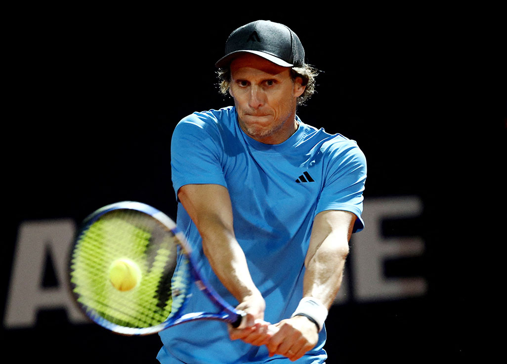 image Forlan swings and misses as tennis debut ends in defeat