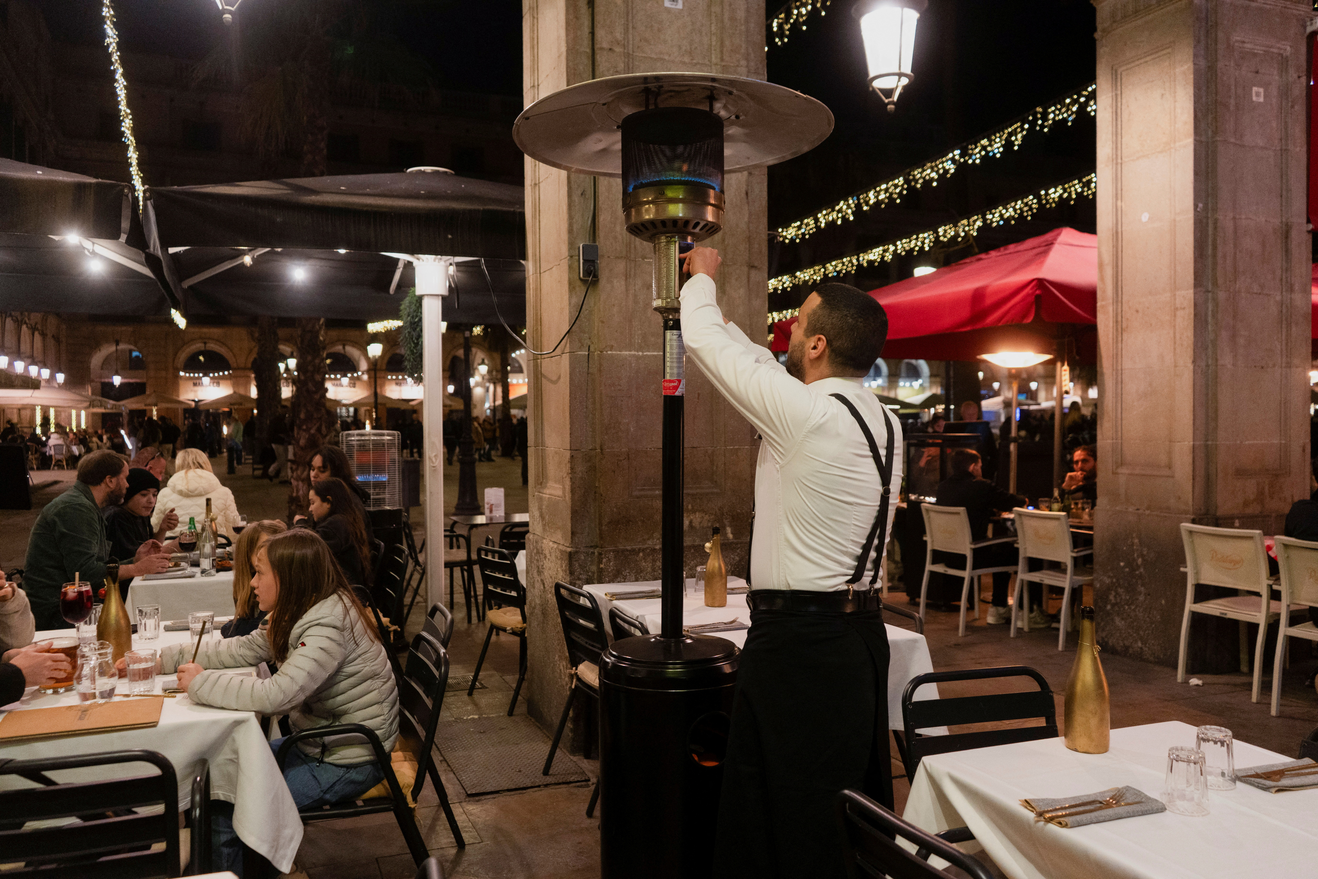 image Tourists enjoy last days of patio heaters on Barcelona&#8217;s terraces