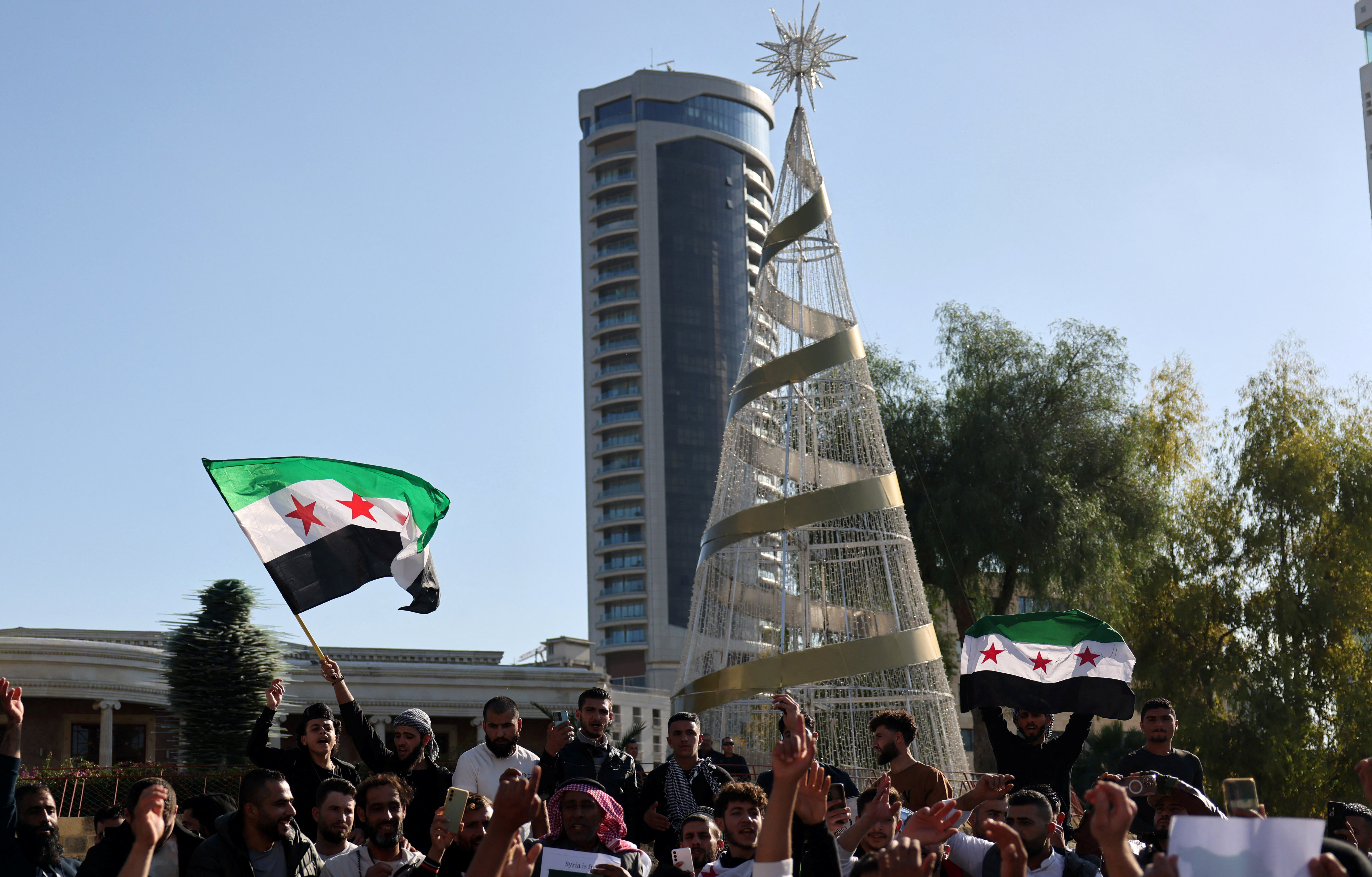 image Syrians rally in Cyprus after Assad toppled