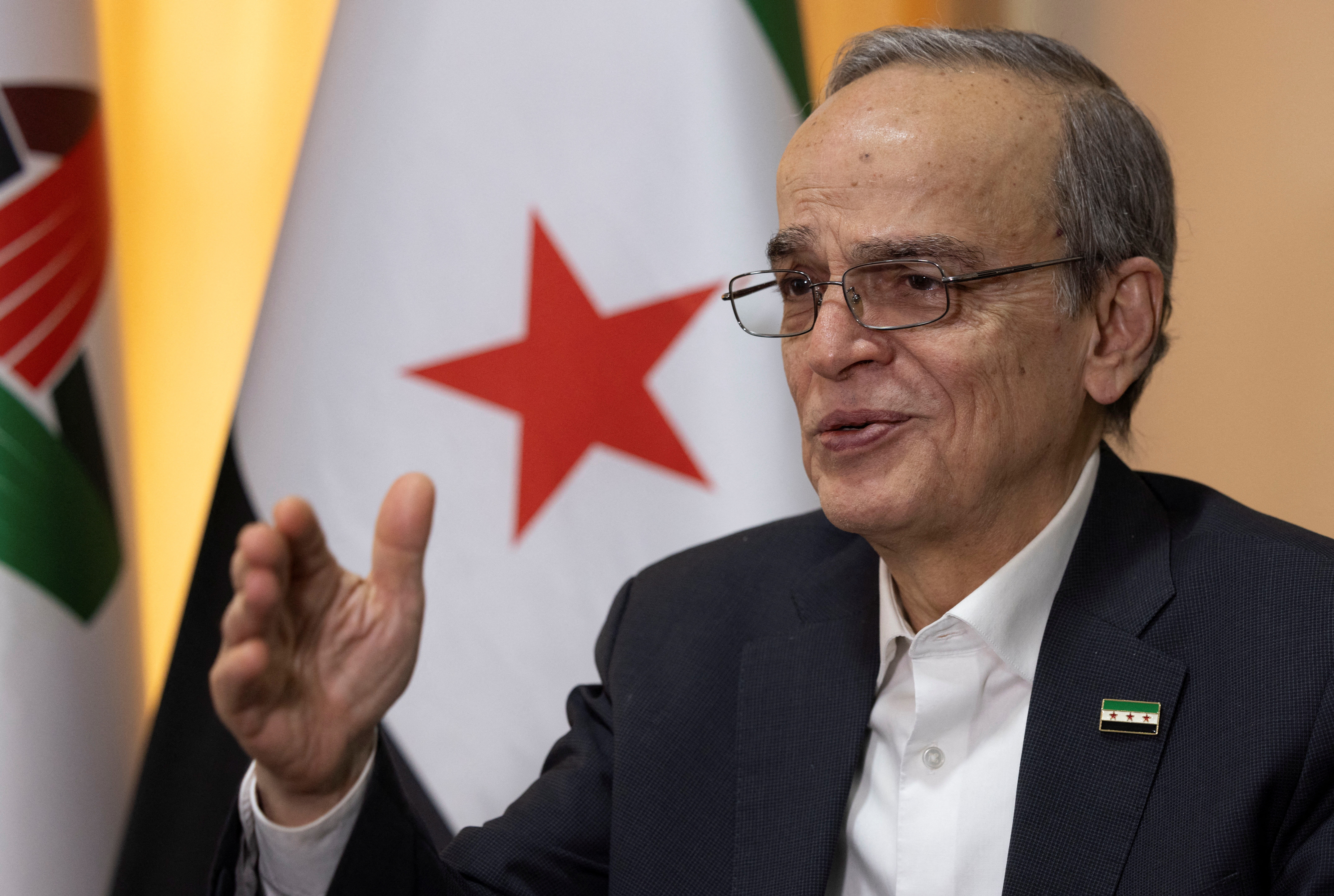 image Syrian opposition leader calls for 18 month transition period before elections