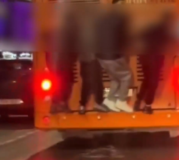 image Minors hitching rides on backs of buses